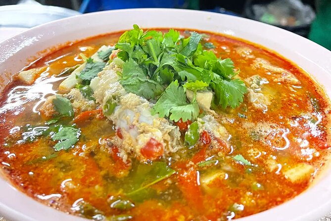 4-Hour Hidden Bangkok TukTuk Street Food Guided Tour - A secret-door view of Wat Prayoon after dark