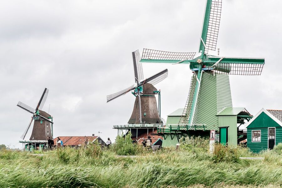 Amsterdam: Guided Zaanse Schans, Windmills & Cheese Tour - Walking into the windmill village