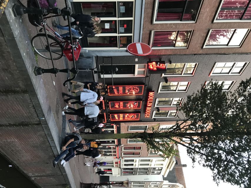 Amsterdam: Private Red Light District and Food Tour - Dutch law, coffee shops, and the questions you actually want to ask
