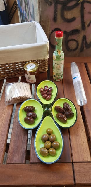 Athens: Traditional Greek food tour in hidden spots - Street food, olive stalls, and a beloved deli