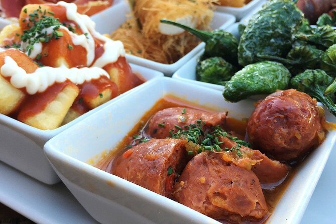 Barcelona Food Tour: Tapas, Drinks and Delights with a Local - Carrer del Regomir and a glass of Cava
