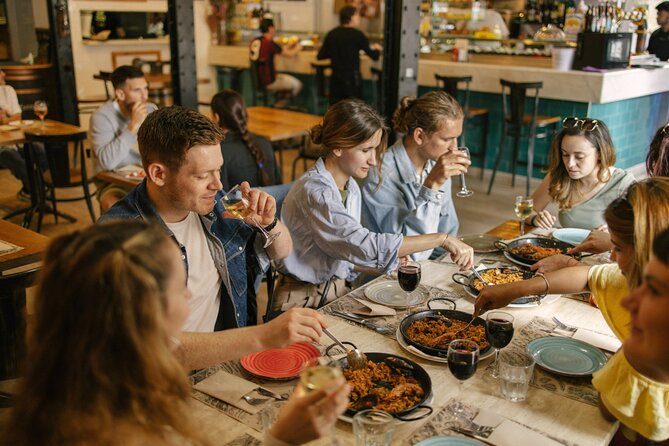 Barcelona: Guided Food Walking Tour with Tapas and Wine - Roman walls on the way to El Born