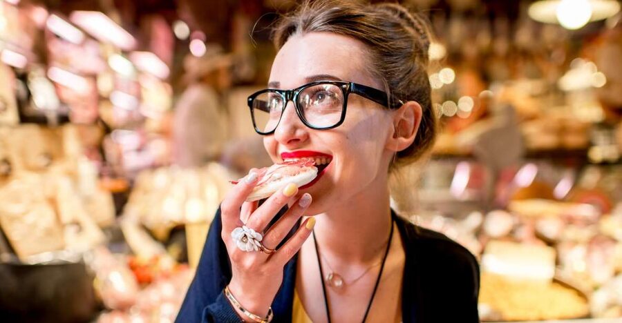 Bologna: Self-Guided Food Tasting Tour with Vouchers - Walking Bologna’s old town between bites