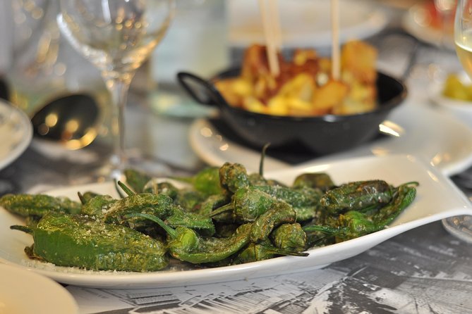 Born to Eat: Gourmet Tapas & Wine Small Group Tour in Old Barcelona - Mercat del Born and the city underneath