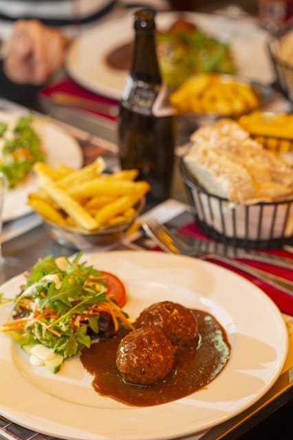 Brussels Food Tour: Main Dish, Beer, Waffle & Chocolate - A Belgian meal served one stop at a time