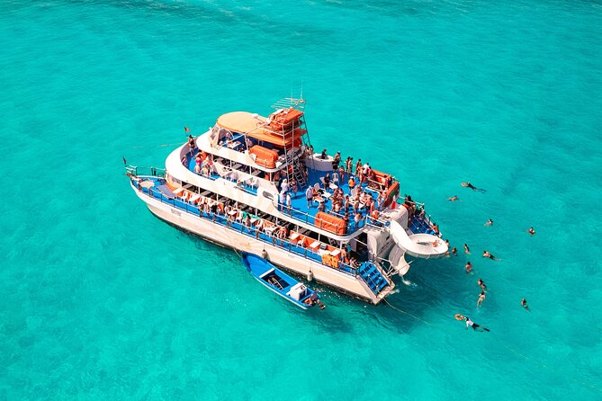 Dancer Cruise Isla Mujeres Snorkel Food and Drinks Included - A party boat with a reef stop built in