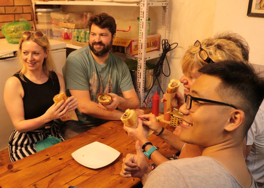 Discover Hanoi's Street Food by Night & Mini Class Coffee - The Old Quarter between food stops