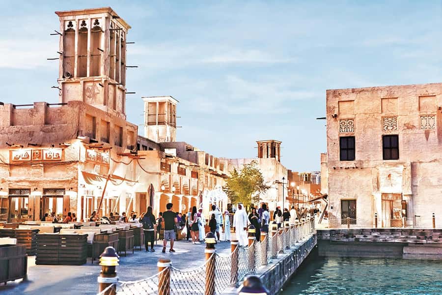 Dubai: Old Town Walking Tour with Abra Cruise & Street Food - Crossing Dubai Creek by traditional abra