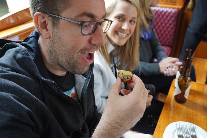 Eating Amsterdam: Food Tour & Canals Cruise - Alleys, wartime memory, and Surinamese roti