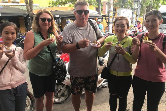 Evening Walking Food Tour, folk game and lantern boat - Vietnamese bingo and the Dap Nieu folk game