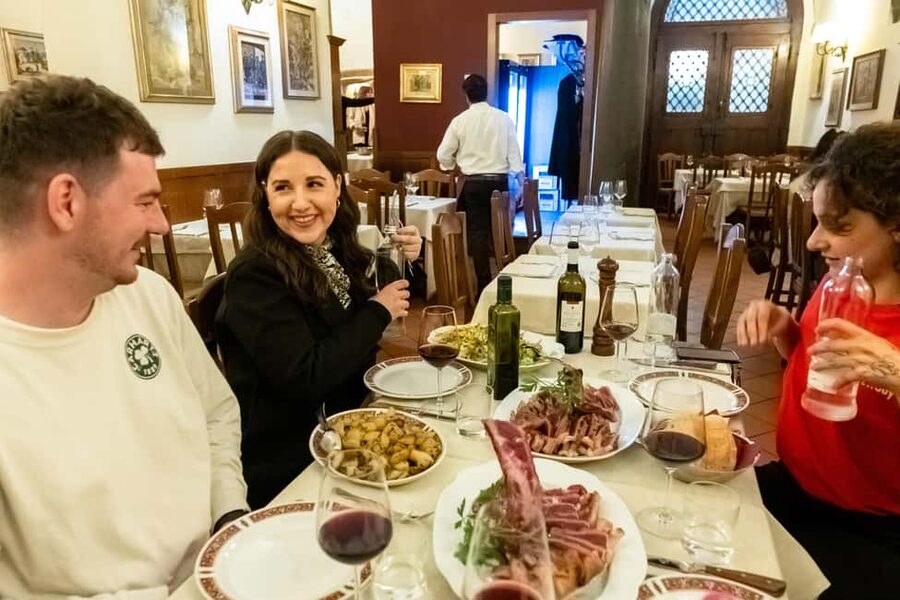 Florence: Food Walking Tour with Local Steak and Tuscan Wine - Crossing Ponte Vecchio into Oltrarno