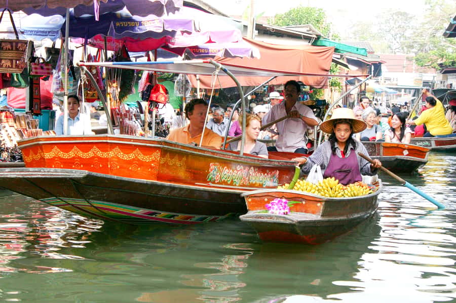 From Bangkok: Maeklong Railway and Floating Market Food Tour - What the guide adds to a touristy attraction