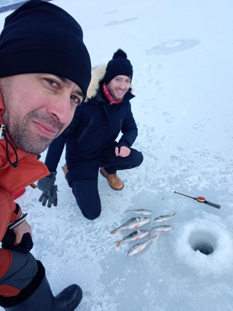 From Helsinki: Bodom Lake Ice Fishing with Food & Drinks - A Finnish laavu and a fire after fishing