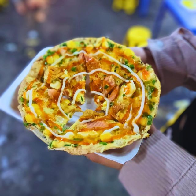 Ho Chi Minh City: Food Tour by Scooter with Eleven Tastings - An old apartment area, sugarcane juice, and bún bò Huế
