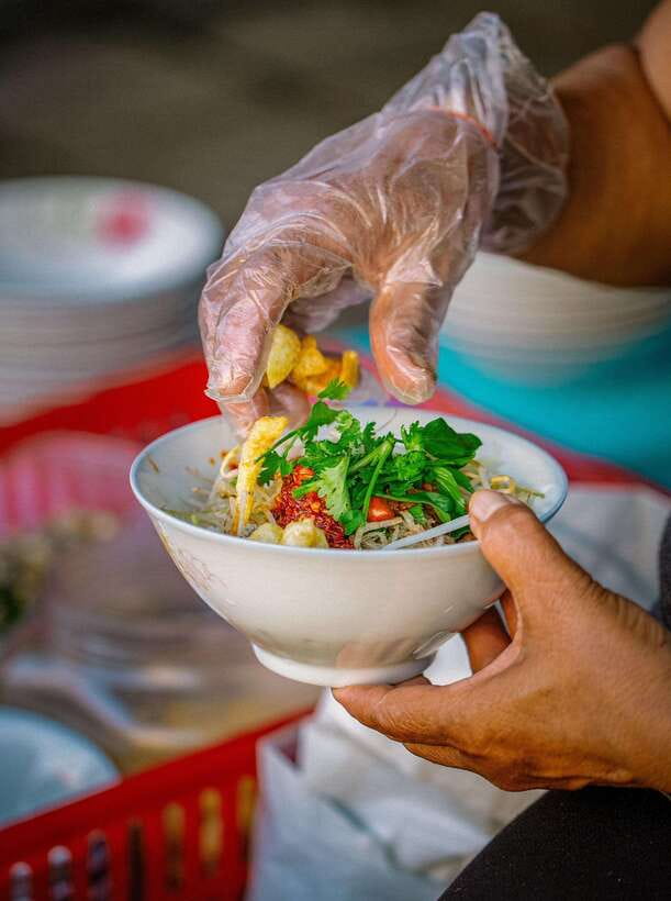 Hue: Guided Local Food Tour with Stories - Walking beside the Perfume River after dark