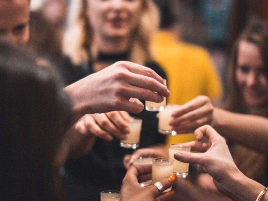 Krakow: Vodka Tasting Tour: Tapas, Tipsy Tales & Hidden Gems - Walking through Krakow’s Old Town between stops