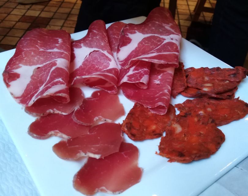 Lake Como: Food Walking Tour - The opening stop: cured meats and wine in a historic shop