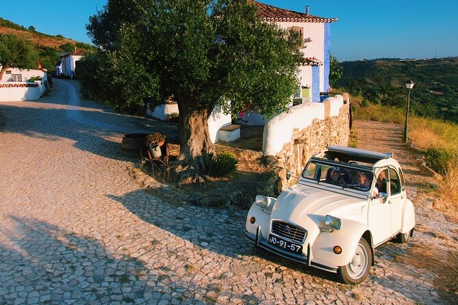 Lisbon Countryside Food Tour on a Vintage Car - A mountain waterfall and quiet rural roads