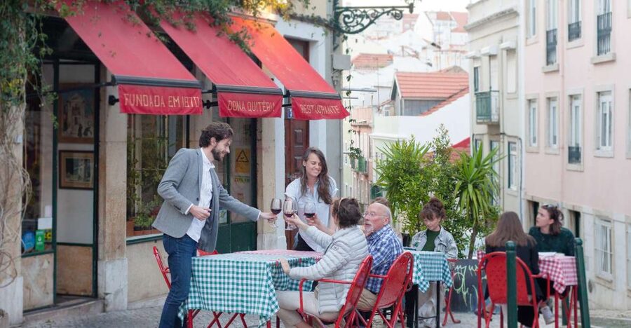 Lisbon: Evening Local Food Crawl with Drink Pairings - Walking uphill for the next bite