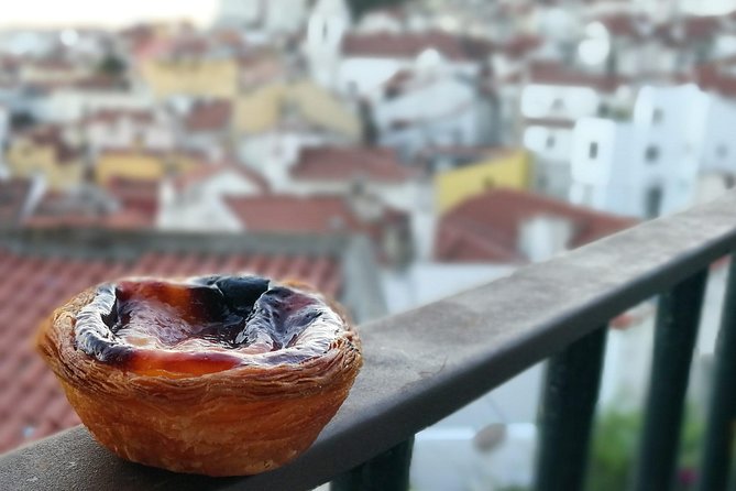 Lisbon Small-Group Food Tour with 18 Tastings in Alfama District - Walking through Alfama’s old lanes