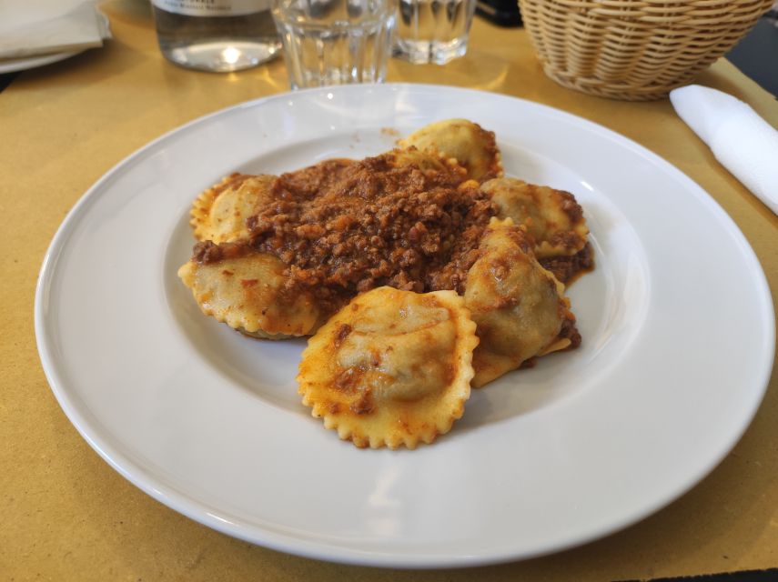 Lucca: Guided Food Walking Tour with Tastings - The first stop: wine, cheese, and local conversation