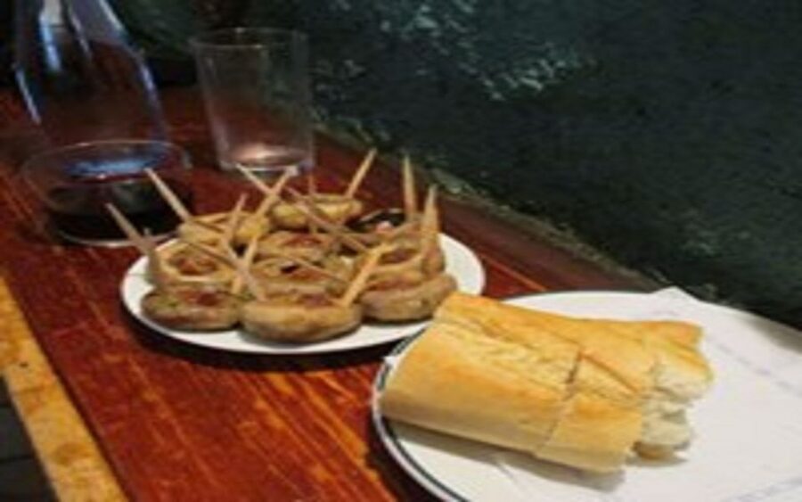 Madrid: Old Madrid Walking Food and Wine Tour - Local bars instead of a single polished restaurant