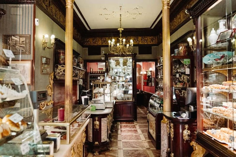 Madrid: Ultimate Food Tour of Local Markets & Tapas - Casa González and a deli with a political past