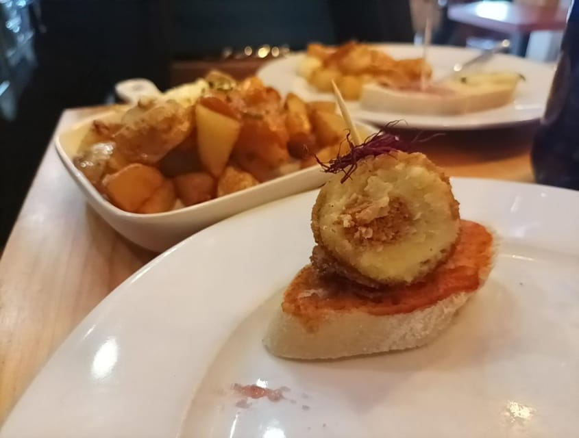 Malaga: Food Tour with Local Guide, Tapas, and Drinks - Russian salad and the Spanish art of small plates