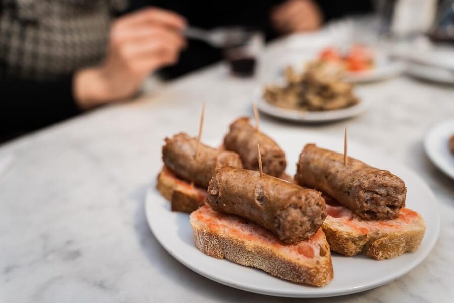 Malaga: Food Tour with Local Guide, Tapas, and Drinks - Octopus, meatballs, and slow-cooked Andalusian dishes