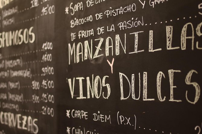 Malaga Wine & Tapas Small Group Guided Tour - Antigua Casa de Guardia and barrel-served Málaga wine