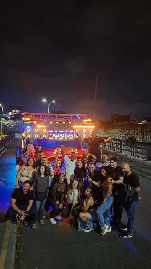 Medellin: Party Bus with DJ & Street Food Tastings - Starting the night in El Poblado