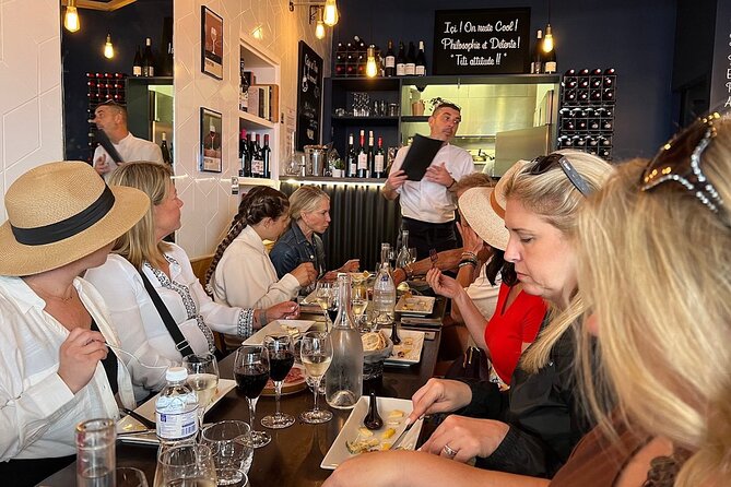 Montmartre Hill French Gourmet Food and Wine Tasting Walking Tour - Moulin de la Galette and the climb to Sacré-Coeur