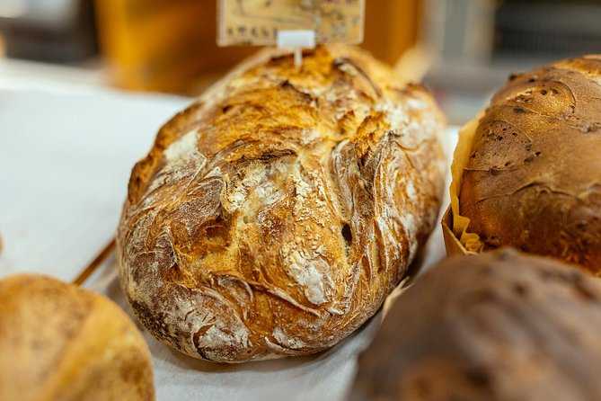 Montmartre Private Food Walking Tour With Locals: The 10 Tastings - Walking uphill through Montmartre