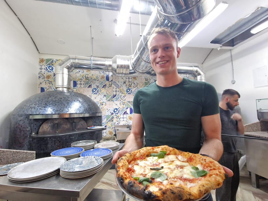 Naples: Pizza Making Class with Local Pizzaiolo - Stretching a thin Neapolitan crust
