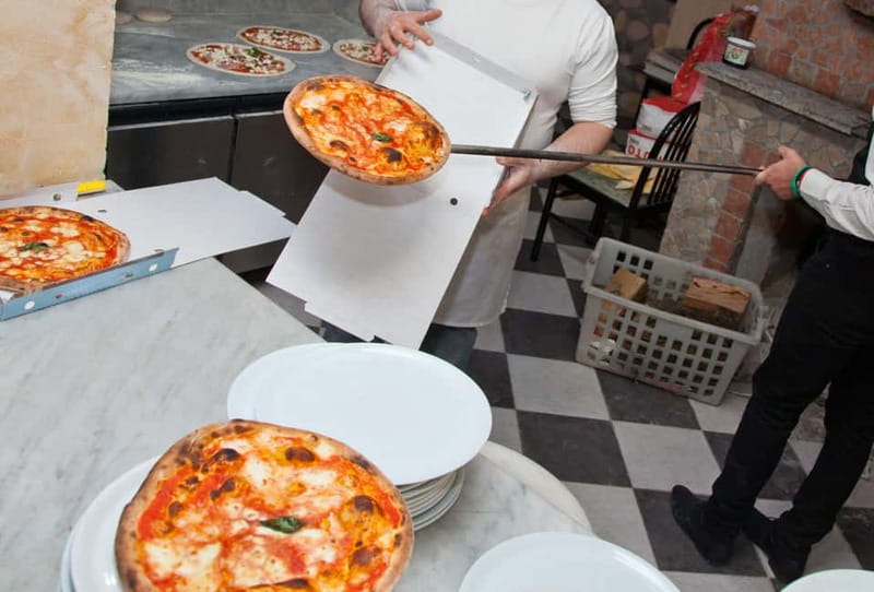 Naples: Premium Pizza Class From Dough to Dessert & Wine - Watching your pizza enter the wood-fired oven