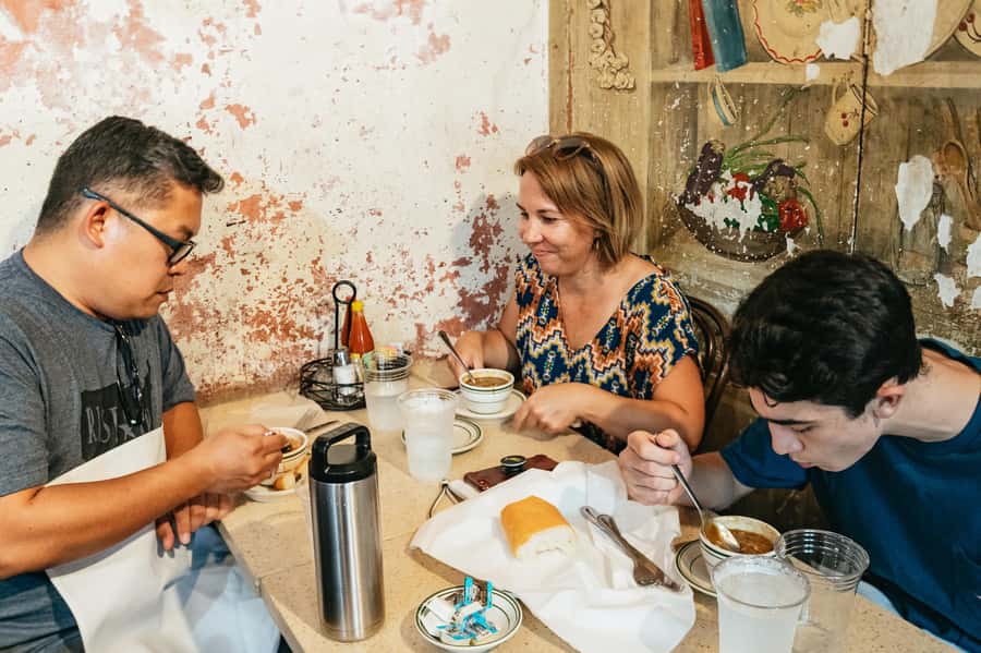 New Orleans: Beloved Bites & Famous Dishes Food Tour - Walking through the French Market