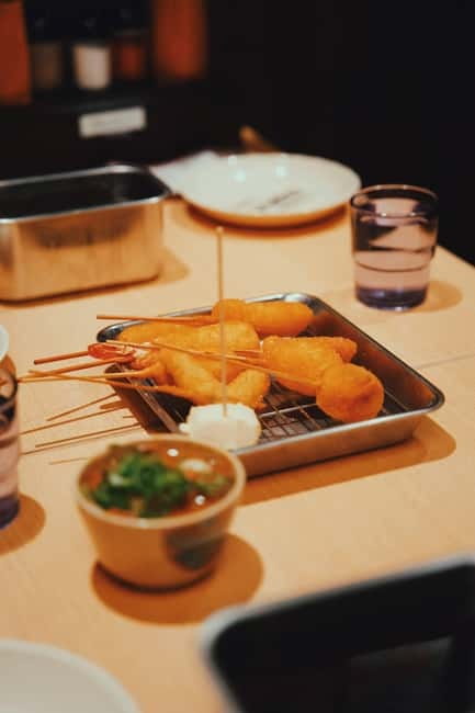 Osaka: 2-Hour Local Street Food Tour – Dotonbori & Namba - Ukiyo-Koji and the short walk between tastes