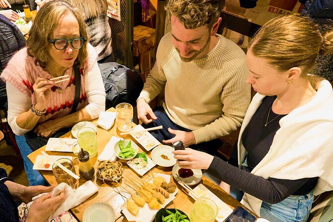 Osaka: Guided Food Tour with 12 Dishes at 4 Local Eateries - Group size, pace, and social atmosphere