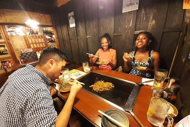 Osaka Local Foodie Walking Tour in Dotonbori and Shinsekai - Walking through old Shinsekai