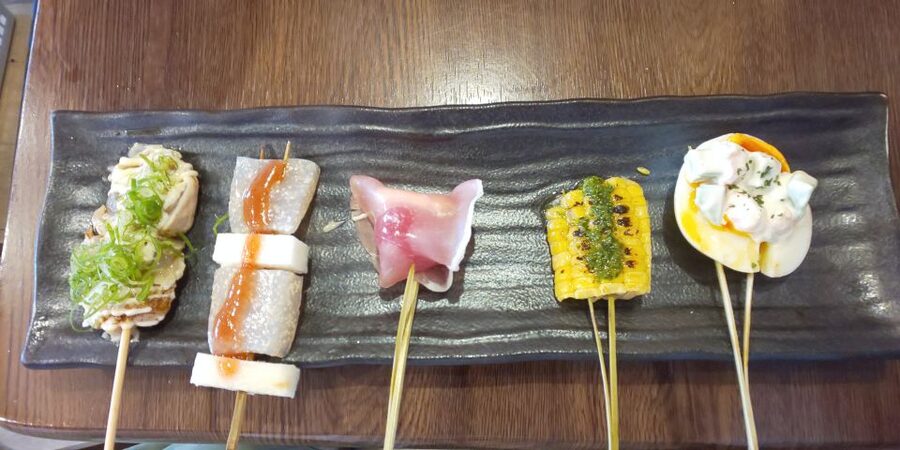Osaka: Shinsekai Food Tour with 13-15 Dishes at 5 Eateries - What the guides add between the meals