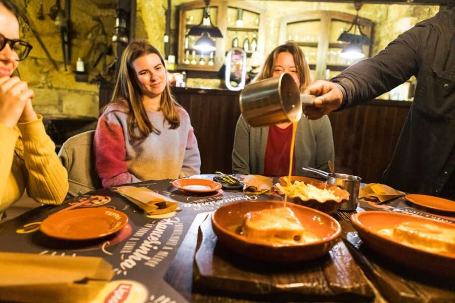 Porto: Food & Wine Tasting Walking Tour with Port Wine Cave - Enter a centuries-old Port cellar