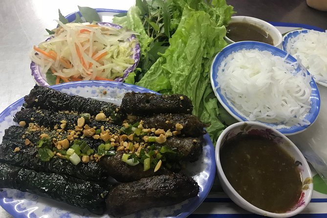 Private Saigon Night Food Tour by Scooter - Old apartments and coconut ice cream at Ngo Gia Tu