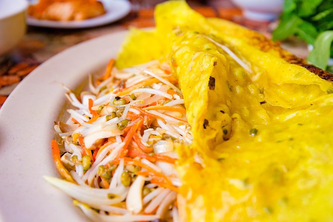 Private Vegan Food Tour By Scooter in Ho Chi Minh City - District 10, flower markets, and local snack stops