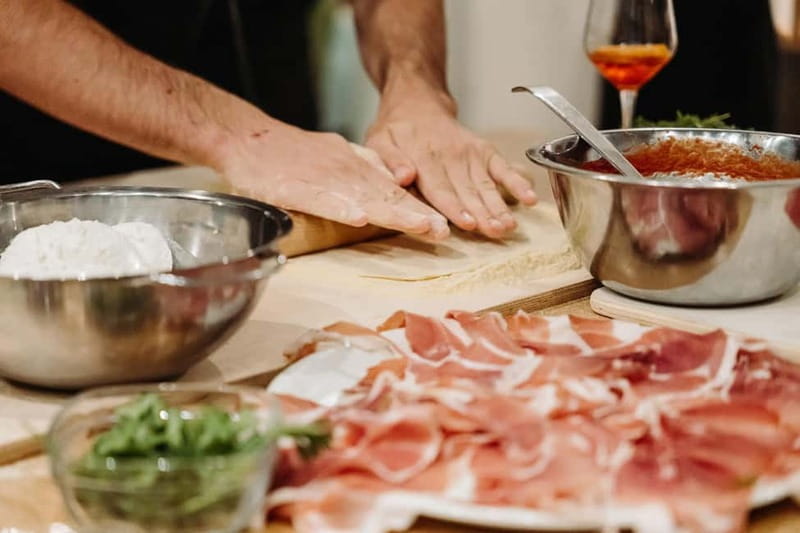 Rome: Pizza Making Class with Gelato & Drinks Included - Stretching, topping, and baking your own pizza