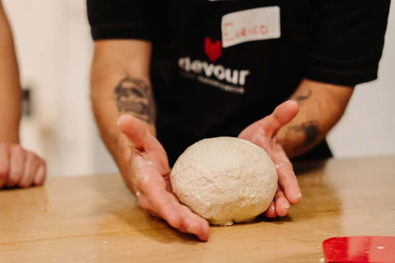 Rome: Pizza Making Class with Gelato & Drinks Included - A shared table with wine, beer, and conversation