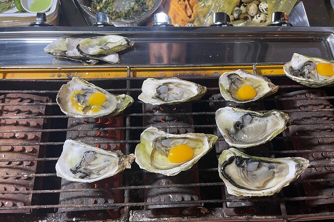 Saigon By Night and Street Food By Motorbike | Opt: Ao Dai Riders - District 4 finishes the food route