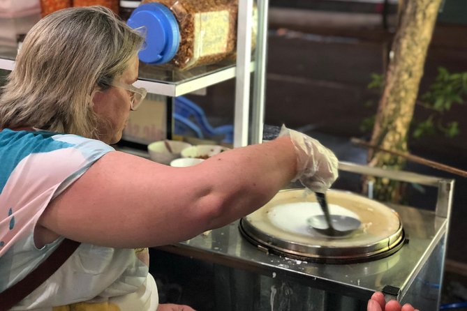 Saigon Evening Food Tour by Scooter - Walking through the 24-hour wholesale flower market