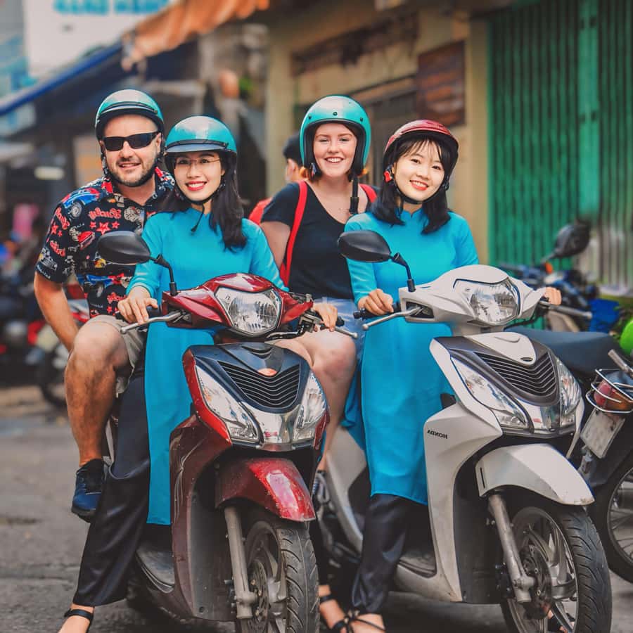 Saigon: Michelin Guide Food Tour with Ao Dai Female Riders - The guides and the feel of the ride