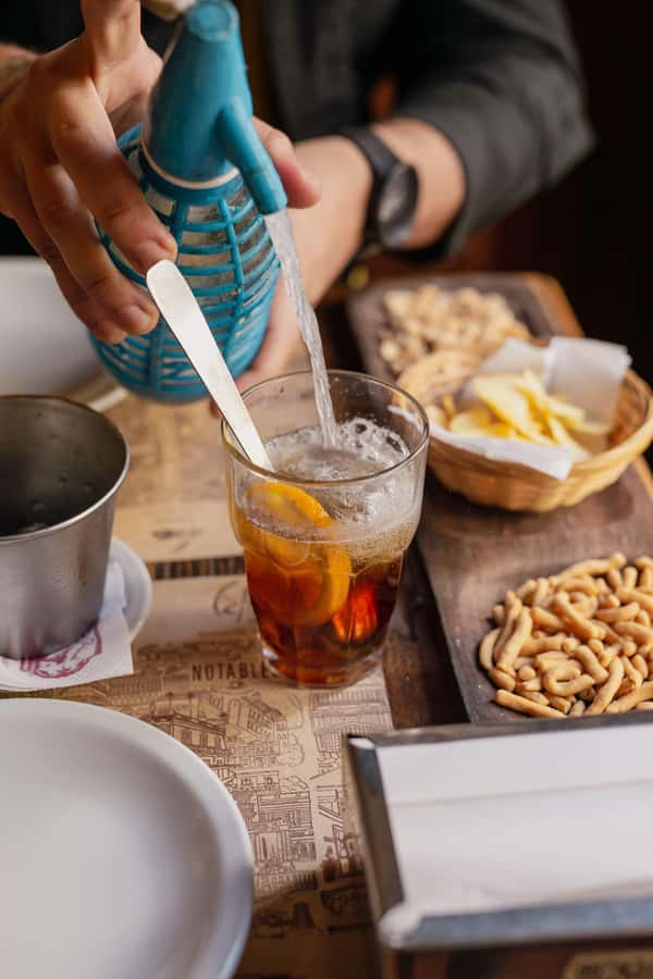 San Telmo: Historical Guided Tour with Street Food & Drinks - Argentine appetizers at a neighborhood bodegón
