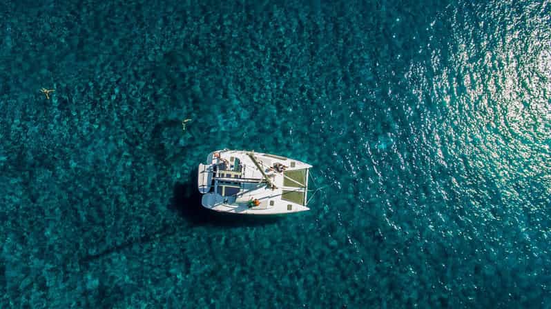 Santorini: Private Catamaran Cruise with Food & Drinks - Red Beach and White Beach from the water